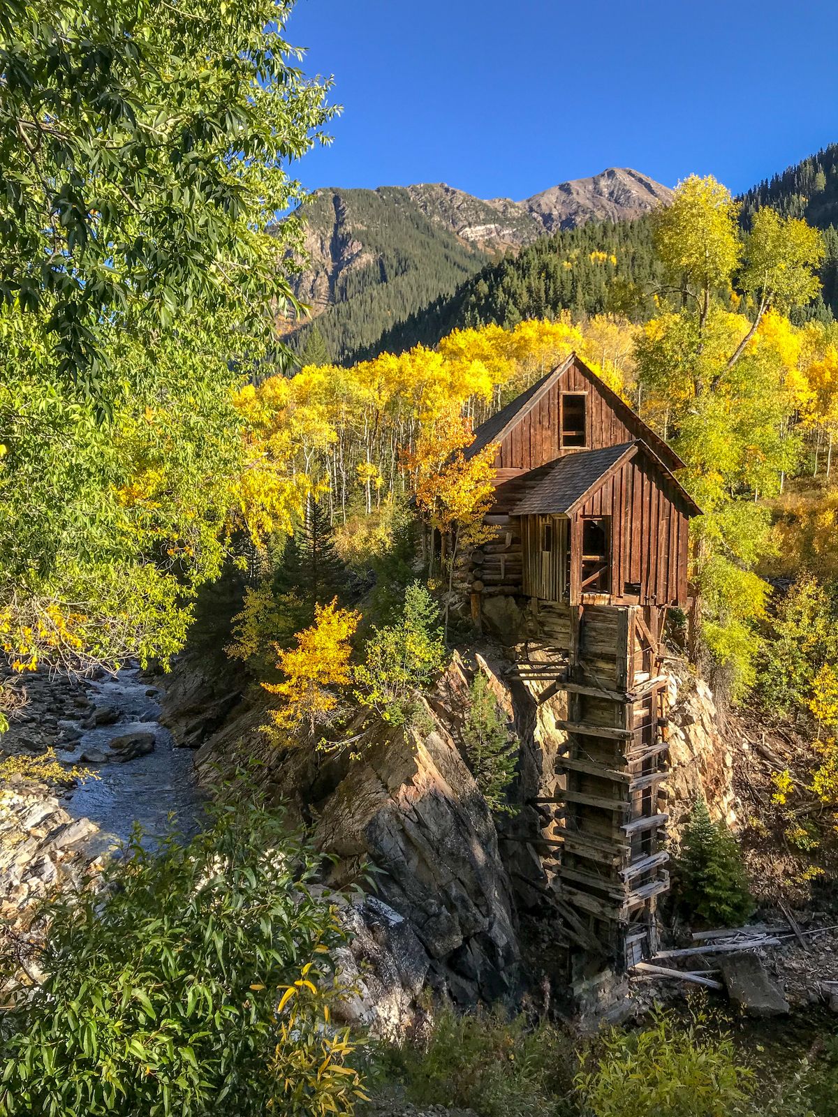 Historic Crystal Mill surrounded by golden aspens